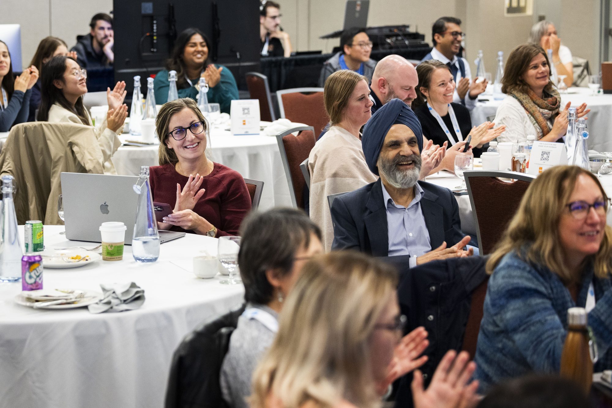 Clinicians applauding at the PEIP by PEER conference