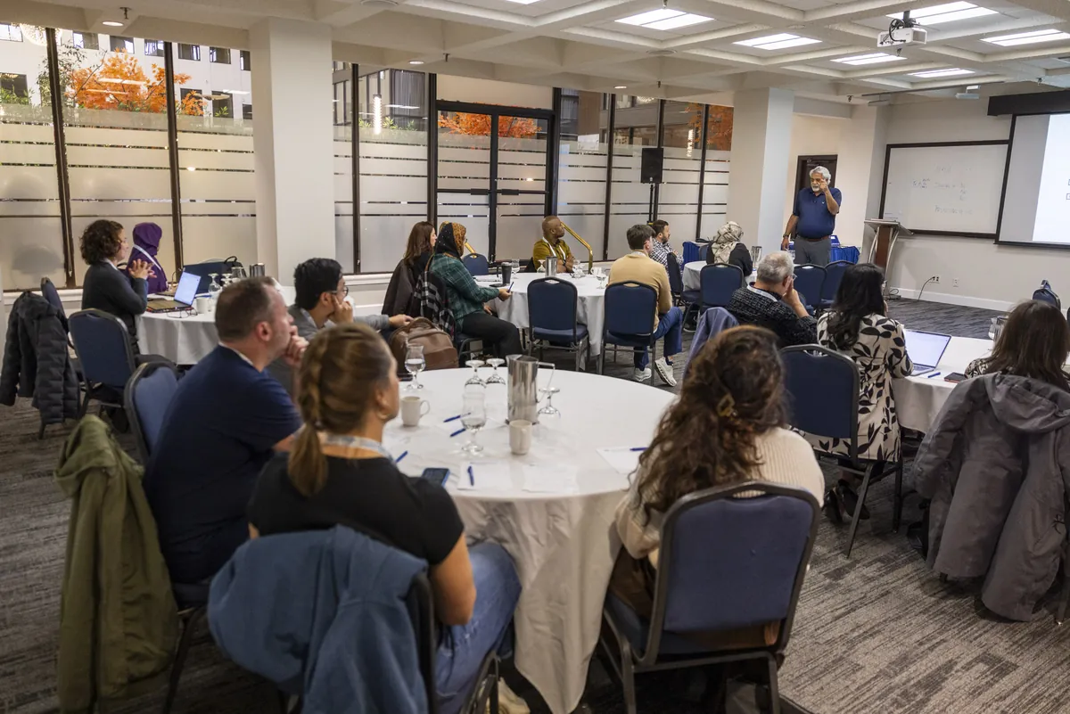 Attendees at round tables during a PEIP by PEER 2026 pre-conference workshop